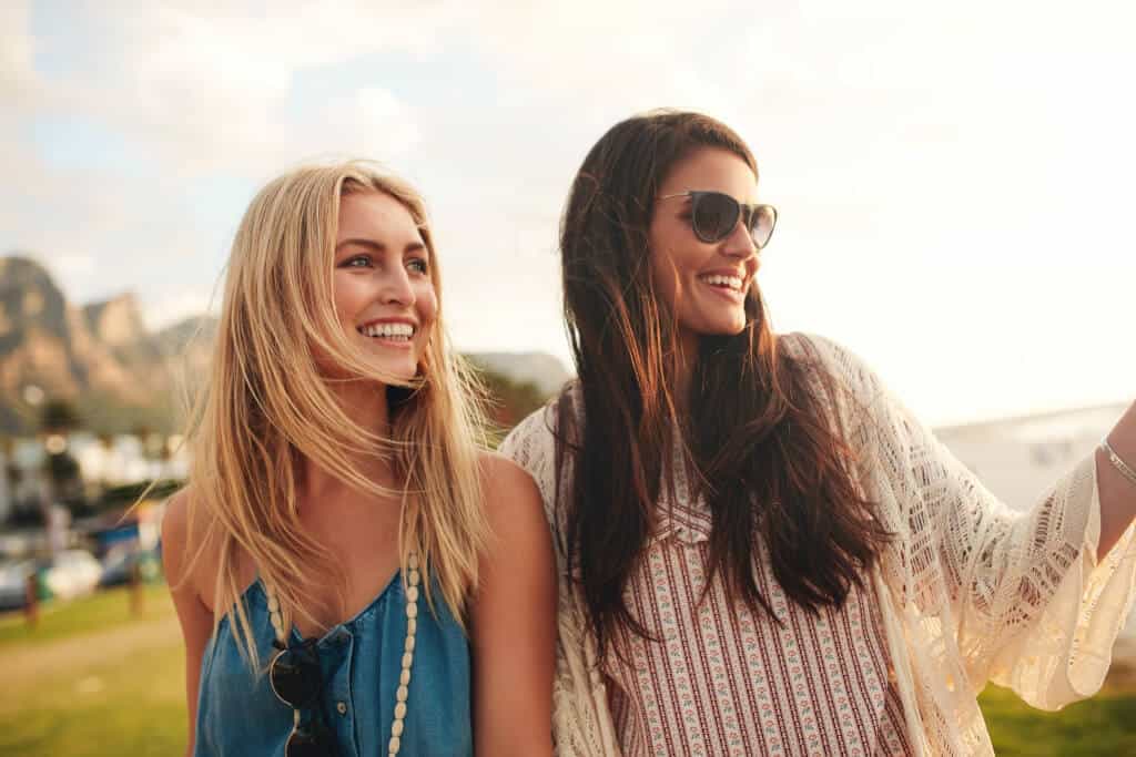 Cheerful young female friends together on a beach
